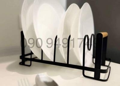 Modern kitchen with clean dishes in rack