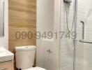 Modern bathroom interior with a white ceramic toilet, electric shower unit, and wooden paneling