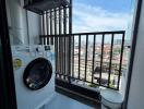 Compact laundry space with washing machine, drying system, and natural light