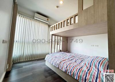 Contemporary bedroom with large window and bunk bed