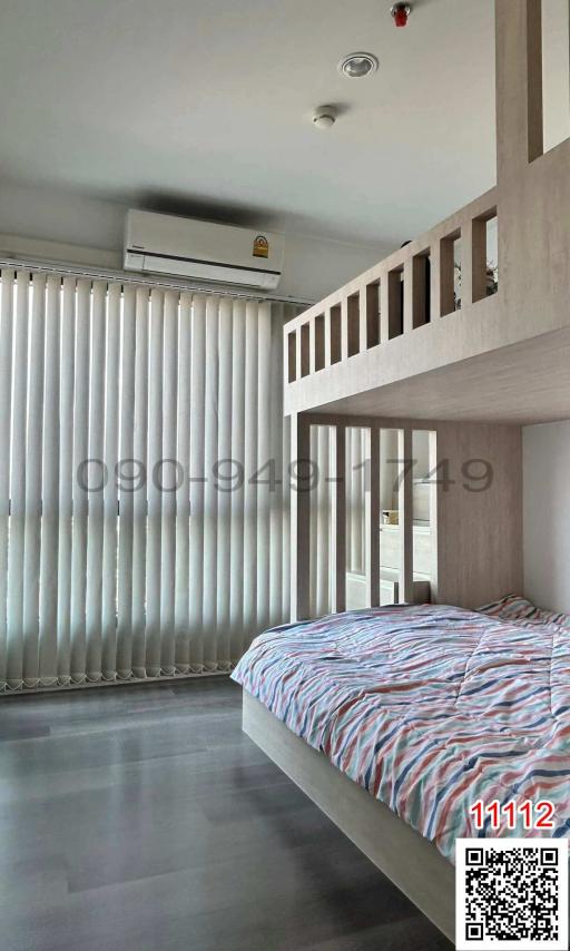 Modern bedroom with a large double bed and a bunk bed structure