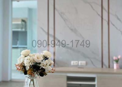 Modern living room with elegant decor and marble wall