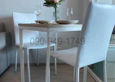 Cozy dining area with a modern white table and chairs setup