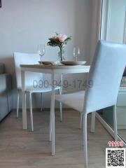 Cozy dining area with a modern white table and chairs setup