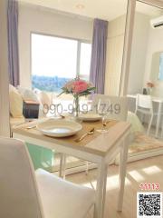 Bright and cozy dining space with table set for two and city view