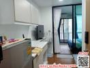 Compact studio apartment interior with integrated kitchen and sleeping area