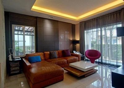 Modern living room with leather couch and stylish decor