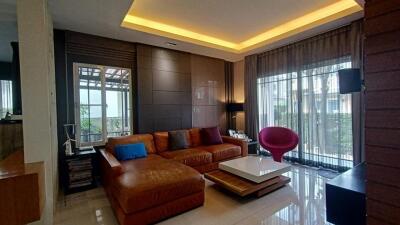 Modern living room with leather couch and stylish decor