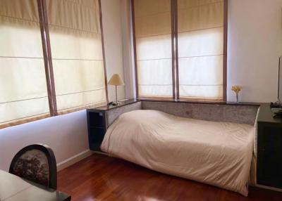 Cozy bedroom with a large bed and natural light