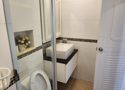 Modern bathroom interior with white and black tiles