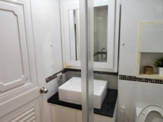 Modern bathroom interior with a glass shower cubicle