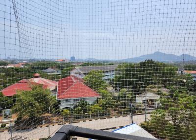 View from balcony overlooking surrounding area with safety net