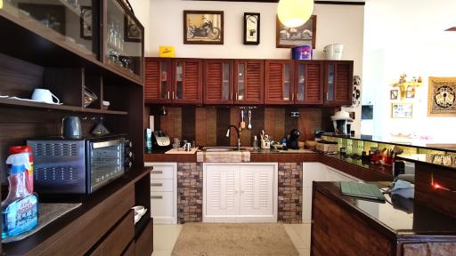 Contemporary styled kitchen with wooden cabinetry and modern appliances