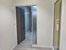 Bright hallway with wooden flooring and modern doors