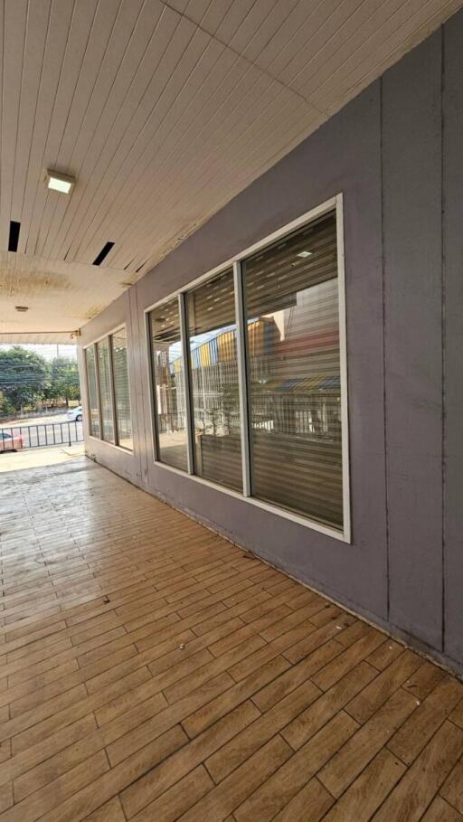 Entrance view of the commercial building with large glass windows