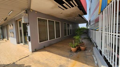 Spacious outdoor area of a contemporary residential building with large windows and ample daylight