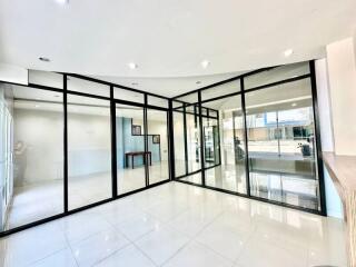 Spacious interior with large glass partitions and polished floor
