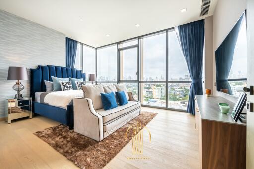 Spacious Bedroom with Large Windows and City View