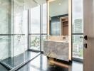 Modern bathroom with large windows and marble tiles