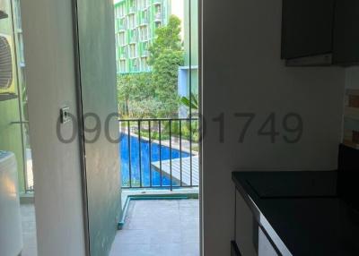 View from interior space towards outdoor area with glass door