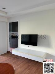 Modern living room interior with mounted television and white entertainment unit