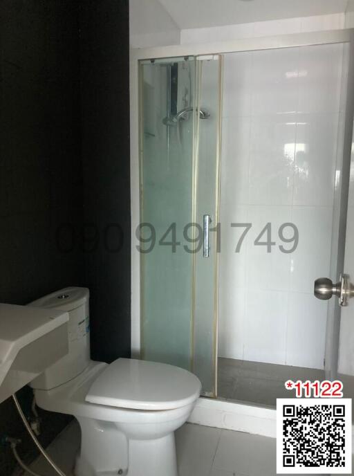 Modern bathroom interior with glass shower and toilet