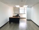 Spacious and well-lit office space with large windows