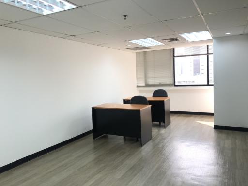 Spacious office space with modern desks and ample natural light