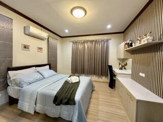 Cozy bedroom with modern decor and ample lighting