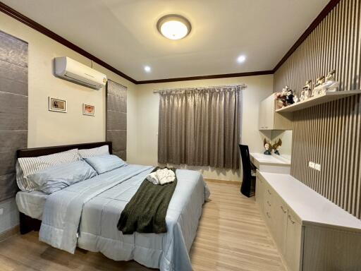 Cozy bedroom with modern decor and ample lighting