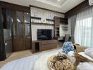 Cozy and well-appointed living room with modern entertainment unit and tasteful decorations