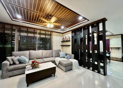 Modern Living Room Interior with Elegant Sofa and Decorative Divider