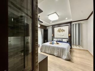Modern bedroom with elegant decor and wooden flooring