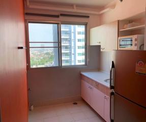 Compact kitchen space with window view in an apartment