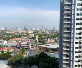 Expansive view from a high-rise building showing the surrounding cityscape