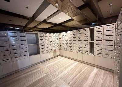 Modern mailroom with numerous mailboxes in a residential building