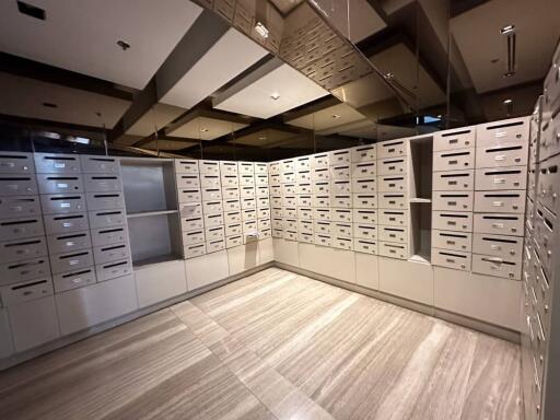 Modern mailroom with numerous mailboxes in a residential building