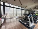 Modern high-rise gym with panoramic city views