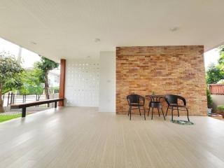 Spacious and modern living space with natural light and stylish seating