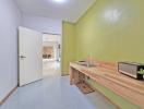 Modern kitchen with wooden countertops and light green walls