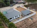 Aerial view of a residential property with a separate garage