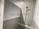 Modern tiled walk-in shower with glass partition