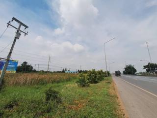 View of a roadside with clear sky and sparse traffic