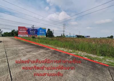 Empty lot ready for development with clear skies and visible utility lines