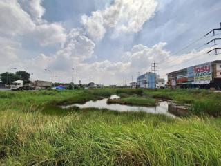 Open landscape near a commercial area with clear skies