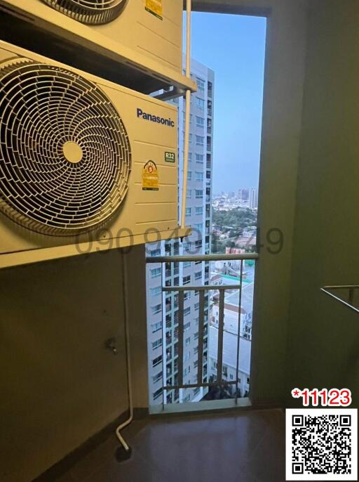 Compact utility area with city view and Panasonic air conditioning units