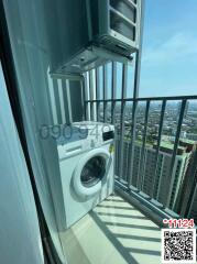 High-rise apartment balcony with a washing machine