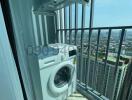 High-rise apartment balcony with a washing machine