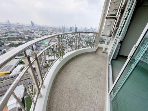 Spacious balcony with city skyline view