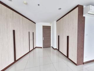 Spacious and well-lit hallway with wooden accents